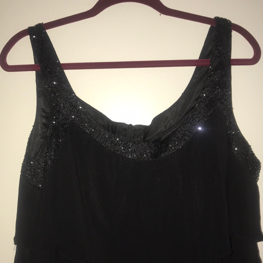 Black dress with frills and sequined shoulders